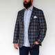 A sports jacket is a staple piece in every man's collection, together we set out to make ours better. The classic shape of this two button Sport Jacket Is updated with a bold plaid, it can easily be paired with a solid button down or matched with a patterned shirt for a modern style. The straight point button label accentuates the length of the torso while allowing the shirt collar to be opened or closed. The most exciting feature, the ultra light-weight fabric makes it the perfect year around piece for warmer climates. This Sport Jacket will be your new go to accessory to take you throughout the day and have you looking your best.

